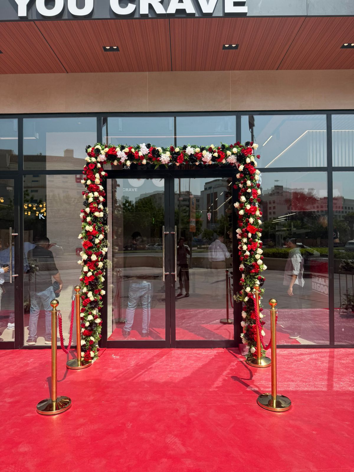 Floral red carpet entrance at event venue